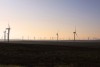 Photograph of wind turbines on landscape